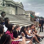 Congresswoman Suzan DelBene speaks with the girls on the Capitol steps.